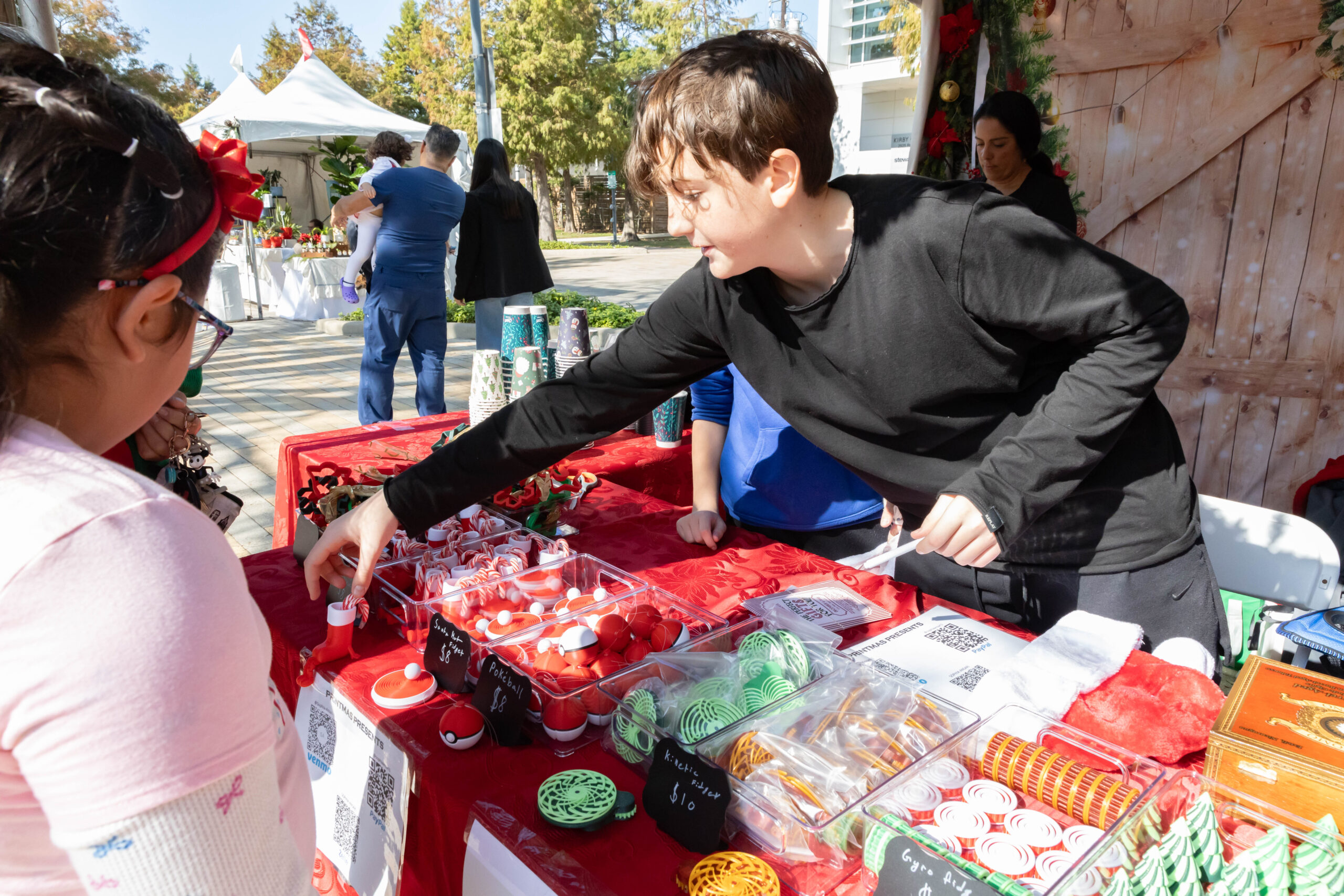 Kid Pitching to a customer